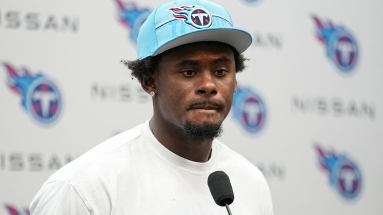Tennessee Titans quarterback Malik Willis responds to questions from reporters...
