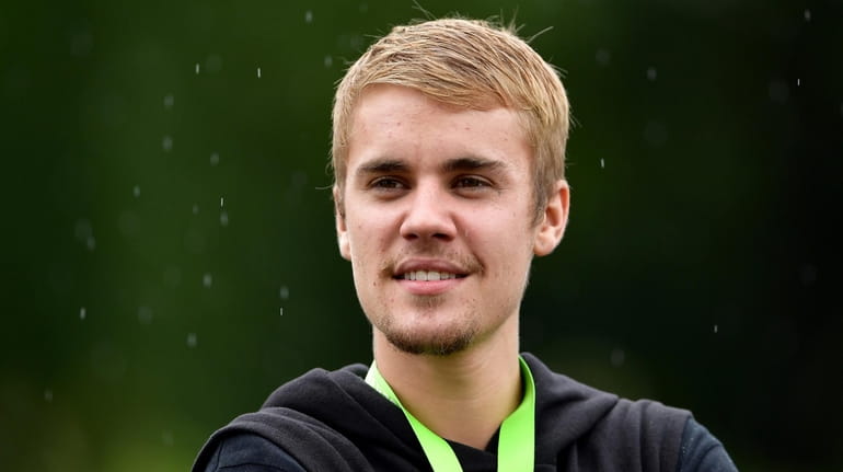 Justin Bieber attends a practice round before the PGA Championship at...