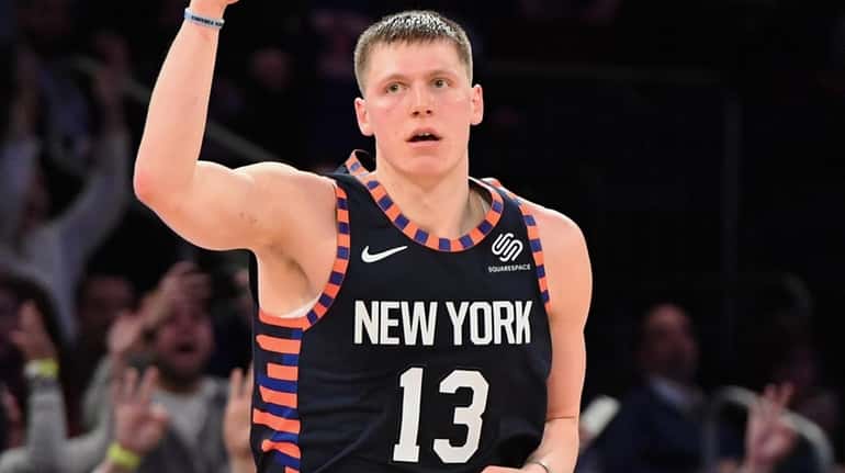 Knicks forward Henry Ellenson reacts after he sinks a three-pointer...