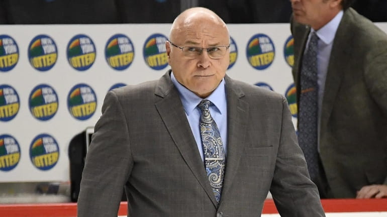 Islanders head coach Barry Trotz walks off the ice after...