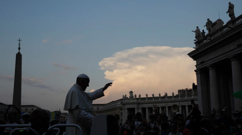 Pope Francis greets the crowds in St. Peter's Square at...