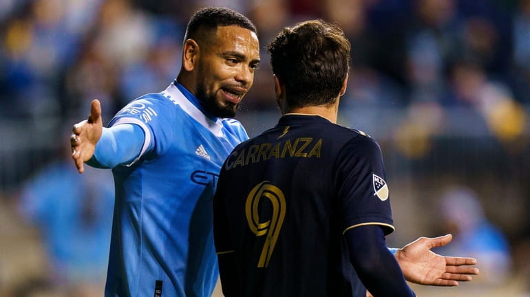 NYCFC's Alexander Callens, left, complains to the Union's Julián Carranza,...