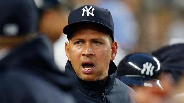 New York Yankees designated hitter Alex Rodriguez calls out to...