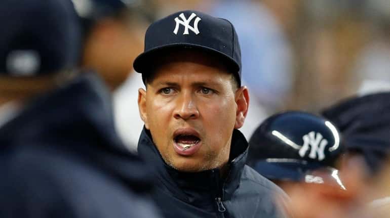 New York Yankees designated hitter Alex Rodriguez calls out to...