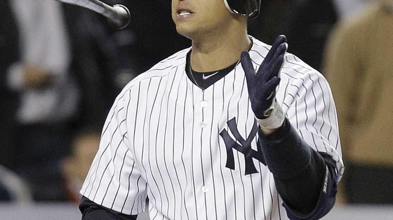 Alex Rodriguez tosses his bat after striking out to end...