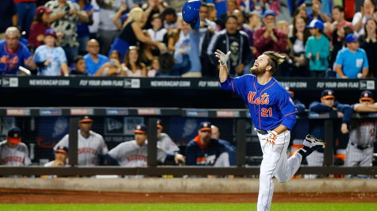 Lucas Duda of the Mets celebrates his ninth-inning, walk-off, two-run...