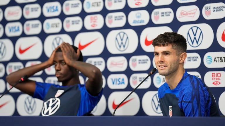 Tim Weah, left, and Christian Pulisic, both of the United...