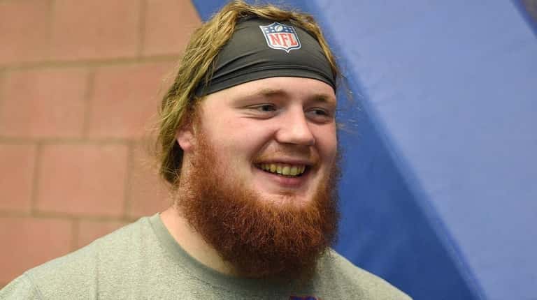Giants center James O'Hagan answers questions from the media after...