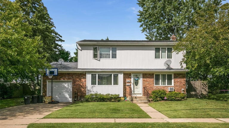 Priced at $849,999, this legal two-family house on Harrison Avenue...