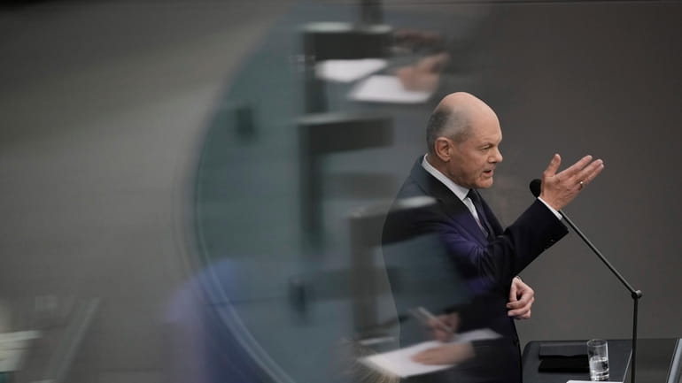 German Chancellor Olaf Scholz answers questions from lawmakers at the...