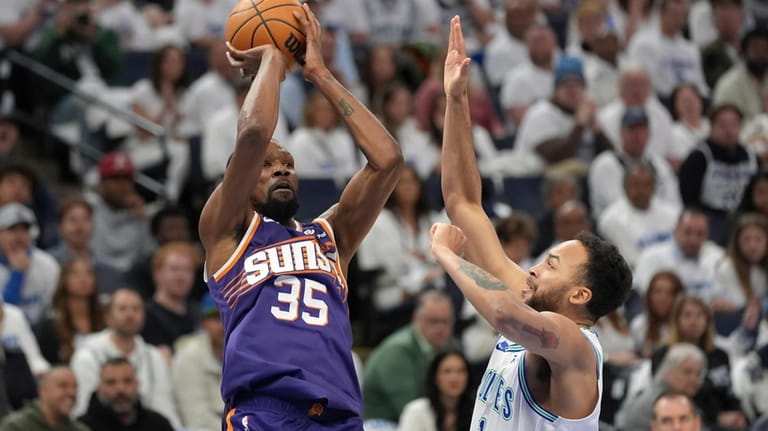 Phoenix Suns forward Kevin Durant (35) shoots over Minnesota Timberwolves...