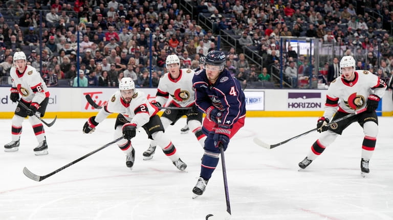 Columbus Blue Jackets' Cole Sillinger (4) looks to shoot against...