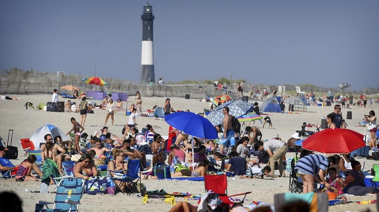 Crowds gather at the beach at Robert Moses State Park...