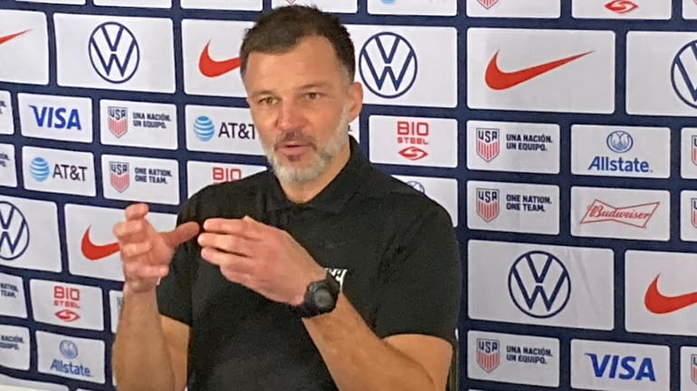 U.S. men’s national team assistant coach Anthony Hudson speaks with...