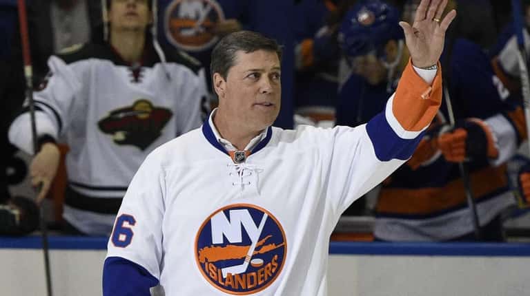 Former Islander and Hockey Hall of Fame member Pat LaFontaine waves...