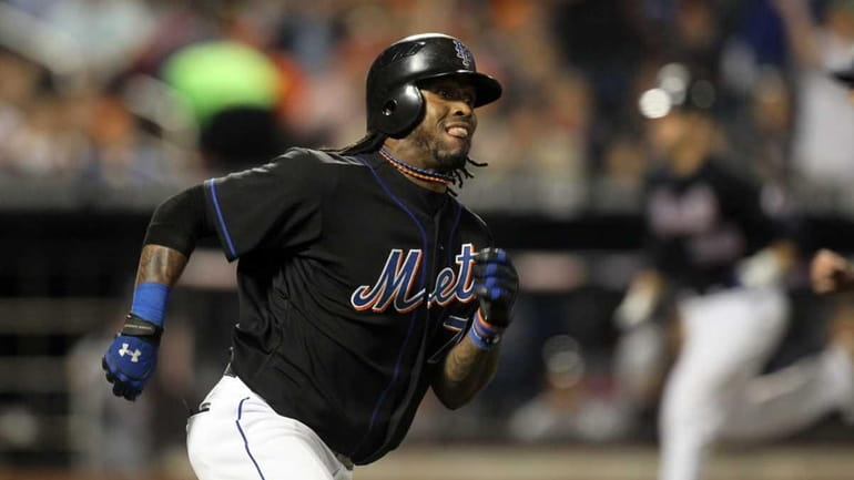 Jose Reyes #7 of the New York Mets runs the...