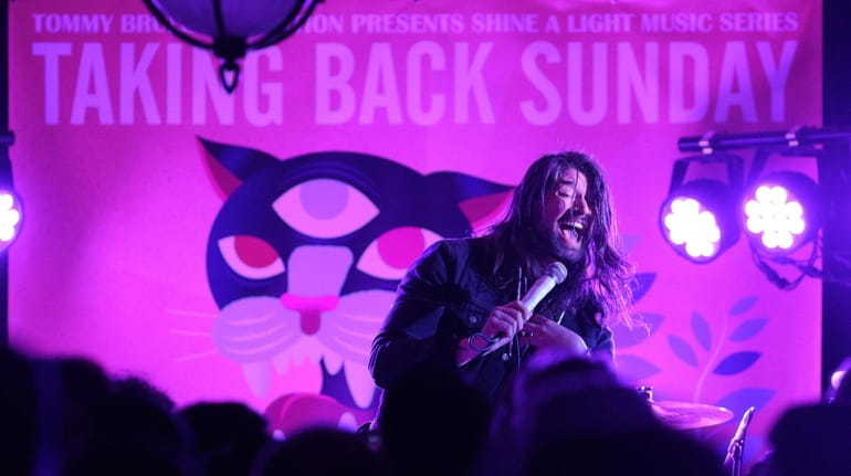Taking Back Sunday's Adam Lazzara performs during a benefit show...