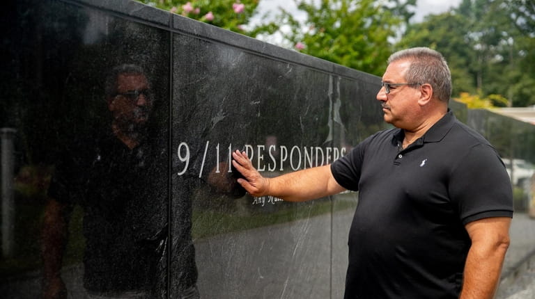 Retired NYPD Officer Glenn Tarquinio visits a 9/11 memorial in Nesconset...