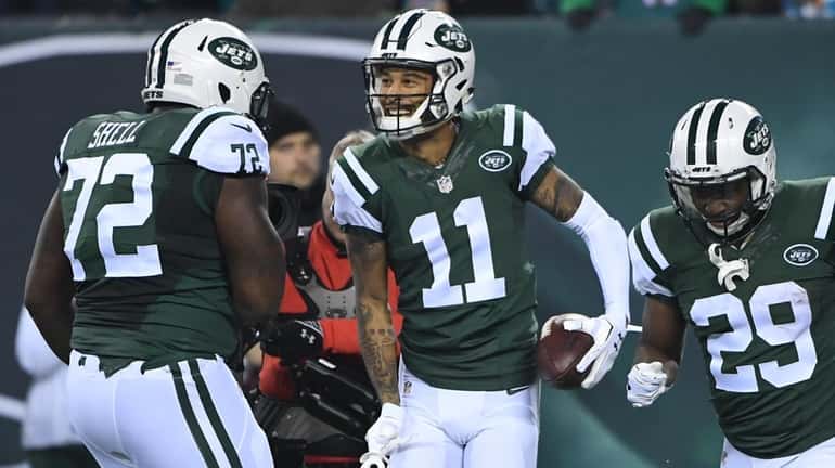 New York Jets wide receiver Robby Anderson, center, celebrates his...