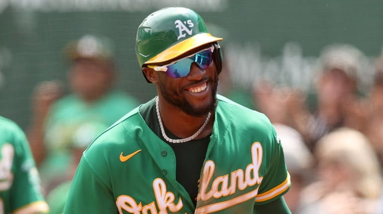 Starling Marte #2 of the Oakland Athletics smiles as he...