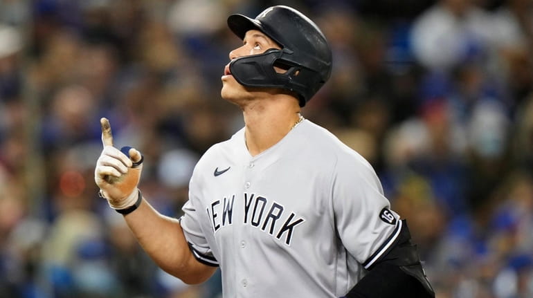 The Yankees' Aaron Judge celebrates his solo home run against...