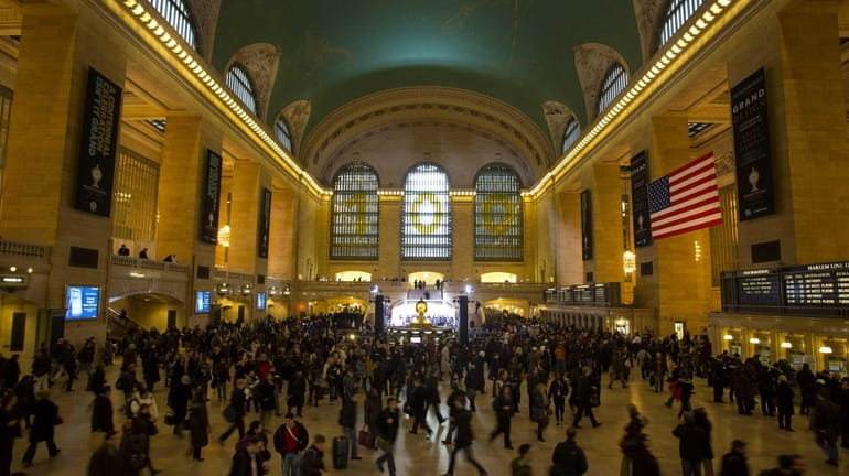 Commuters pass through Grand Central Terminal before the official kick...