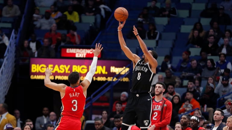 Nets guard Spencer Dinwiddie (8) attempts a 3-point shot against...