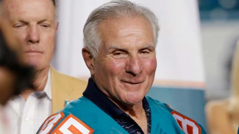 Former Miami Dolphins player Nick Buoniconti, left, is presented a...