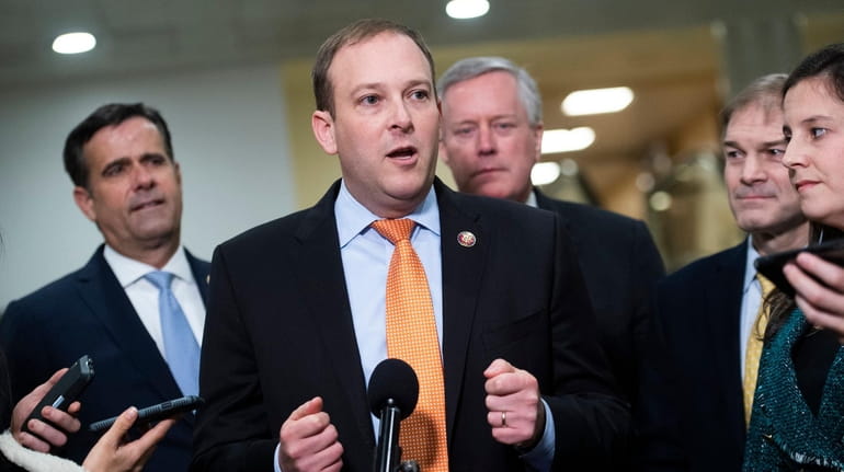 Rep. Lee Zeldin, center, conducts a news conference in the...