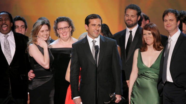 Steve Carell, center, joined fellow "The Office" cast members to...