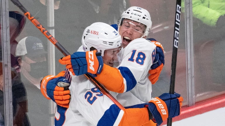 Islanders' Brock Nelson (29) celebrates with Anthony Beauvillier (18) after...