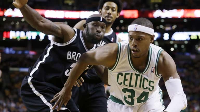 Boston Celtics' Paul Pierce (34) drives against Brooklyn Nets' Reggie...