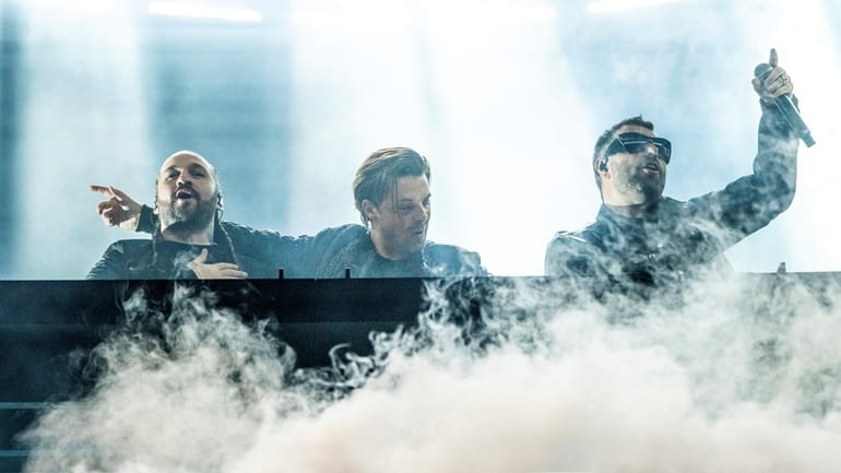 Swedish House Mafia's Steve Angello, left, Axwell, and Sebastian Ingrosso...