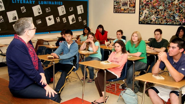 Wheatley High School teacher Faith Toperoff talks to her English...