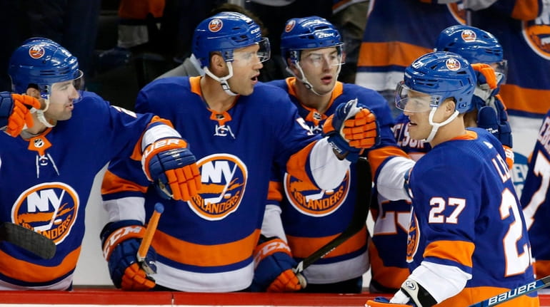 Anders Lee #27 of the Islanders celebrates his first period...