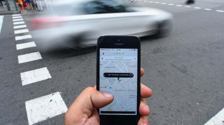 The Uber Technologies Inc. car service application is demonstrated on...