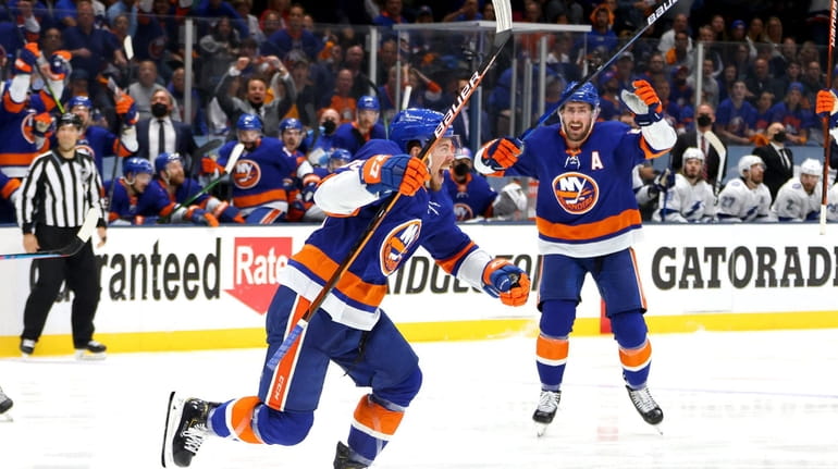 Anthony Beauvillier #18 of the Islanders celebrates after scoring the game-winning...