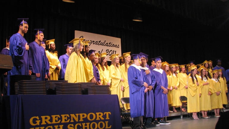 Greenport High School students wait to get their diplomas during...