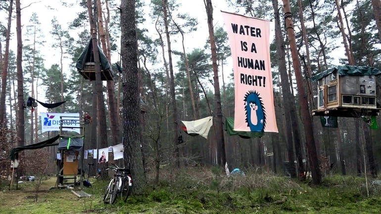 Activists occupy an area in the forest in Groenheide, Germany,...