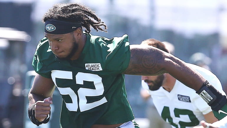 Jets edge rusher Jermaine Johnson II works out during training camp at...