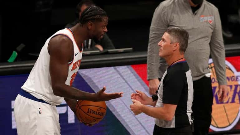 Julius Randle of the Knicks argues with the referee after he...