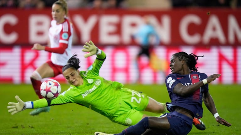 PSG's Tabitha Chawinga, right, scores her side's first goal past...