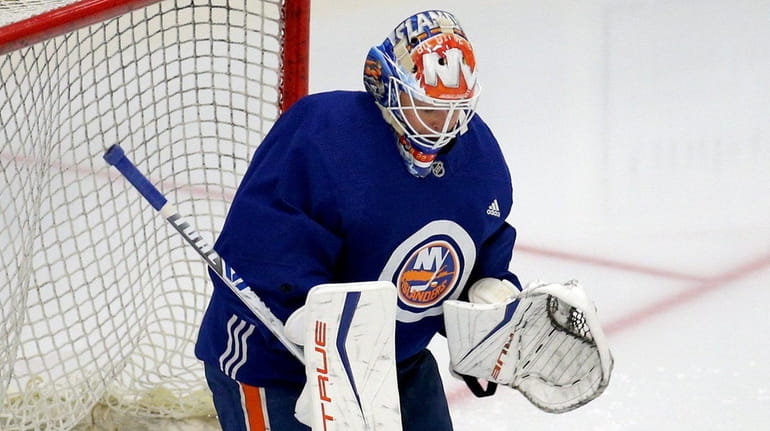 Islanders goalie Cory Schneider makes a save during training camp at...