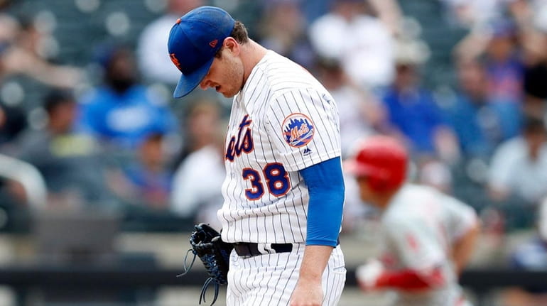 Mets relief pitcher Justin Wilson reacts on the mound as...