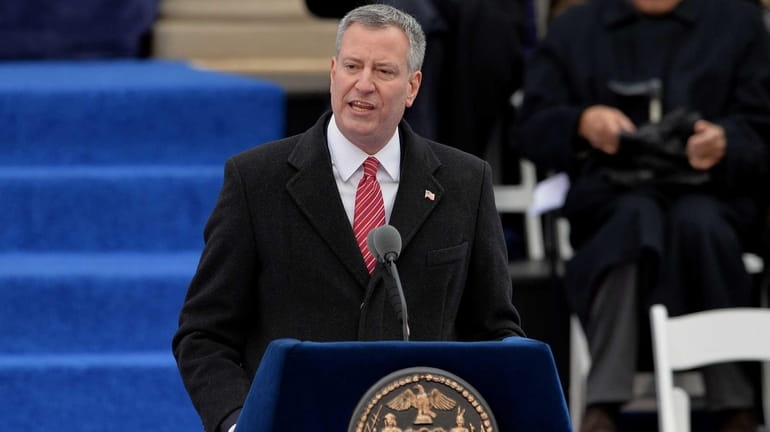 New York City Mayor Bill de Blasio speaks after a...