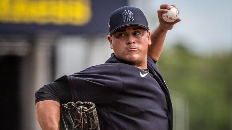 Manny Banuelos, throwing during spring training on Wednesday, pitched a...