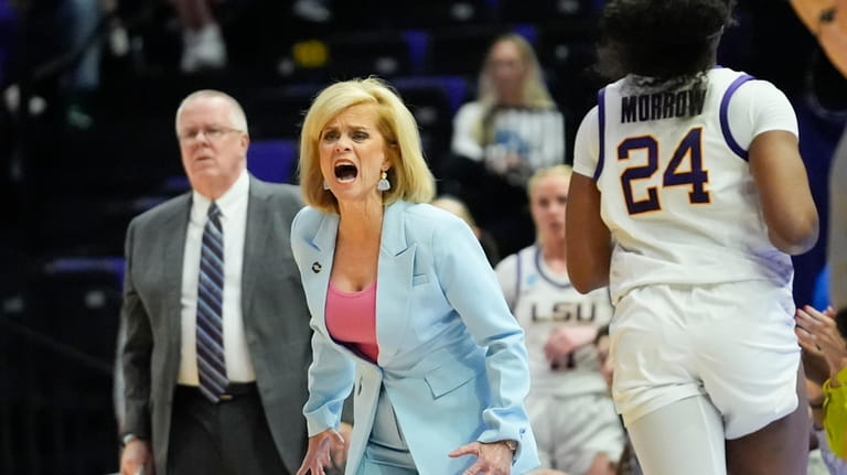 LSU head coach Kim Mulkey calls out from the bench...