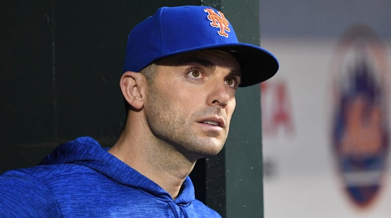 The Mets' David Wright looks on from the dugout during...