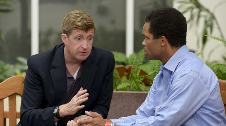 Former U.S. Rep. Patrick J. Kennedy, left, meets with U.S....