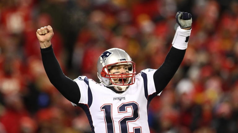 Tom Brady #12 of the New England Patriots celebrates after...